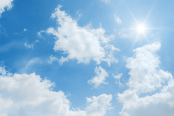 Naklejka na ściany i meble cloudy blue sky and sun