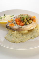 grilled carp steak on organic potato and vegetable