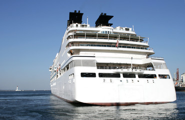 big white steam-ship  leaves port