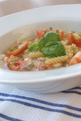 mediterranean noodle soup with white beans and tomato