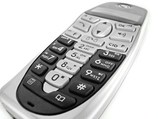 close of a modern handset phone isolated on white