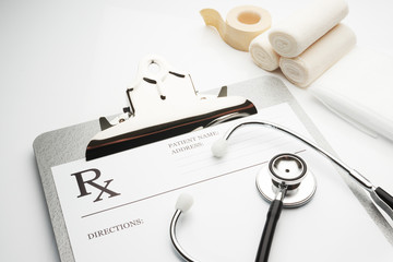 rx prescription on clipboard with stethoscope
