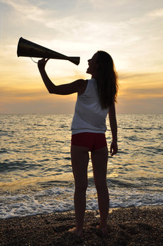 girl shouting into a megaphone