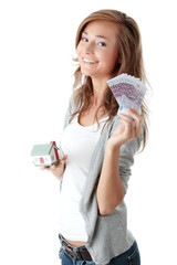 Naklejka premium Woman holding euros bills and house model