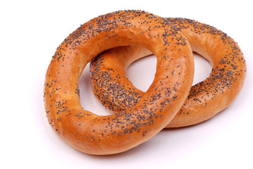 Two big bagels with a poppy