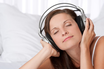 Young woman enjoying music with headphones