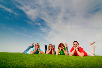 friends lying on grass