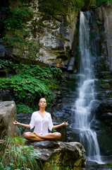 Woman doing yoga in the nature