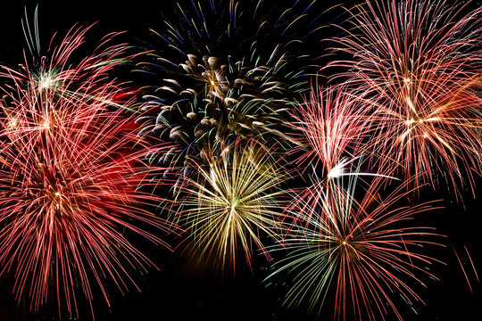 Colorful firework show finale with multiple bursts