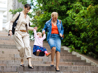 Family on a park staircase