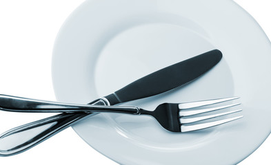 Knife and fork on a plate