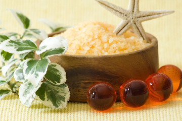 bowl of orange salt bath and oil bath pearls