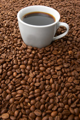 Cup with coffee, costing on coffee grain
