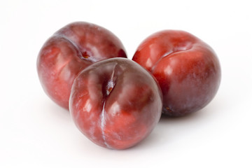plums on white