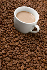 Cup with coffee, costing on coffee grain