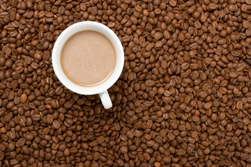 Cup with coffee, costing on coffee grain