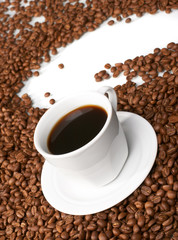 Cup with coffee, costing on coffee grain