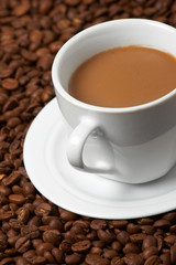 Cup with coffee, costing on coffee grain