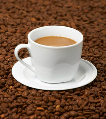 Cup with coffee, costing on coffee grain