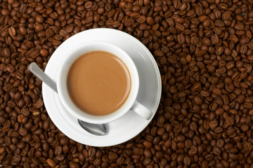 Cup with coffee, costing on coffee grain