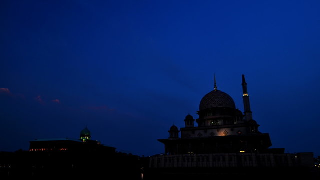 The Sun sets over The Putra Mosque at Putrajaya, Malaysia.