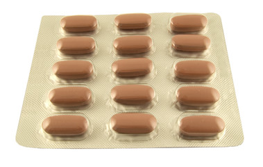 dark red pain killers in packet on white background