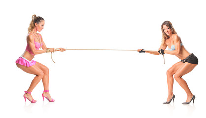 Beautiful girls pulling a rope isolated on white background