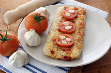 stone oven backed pizza with fresh tomato and garlic
