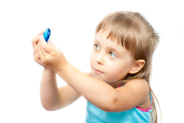 girl looking through blue glass stone