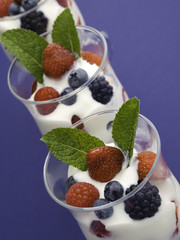 three yogurt on blue
