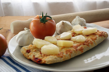 stone oven backed pizza with pineapple