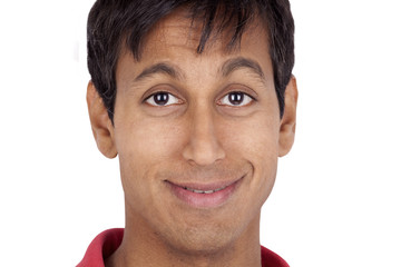 Fototapeta premium Closeup portrait of a smiling young man isolated