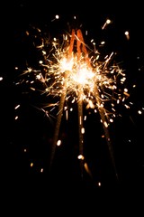 Fototapeta na wymiar yellow sparkler with fire particles