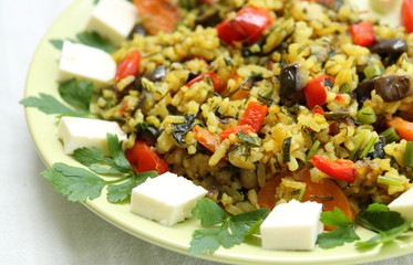 Delicious lunch. Fried rice with vegetables and herbs