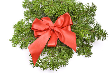Decorated christmas-tree branch with red bow