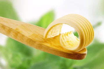  Butter curl on a wooden spoon © Viktor