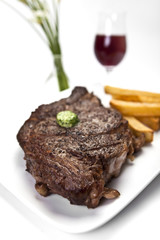 Fototapeta na wymiar USDA Prime Ribeye Steak and Fries