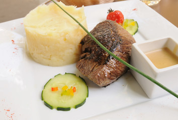 juicy veal - beef meat with tomato and potatoes