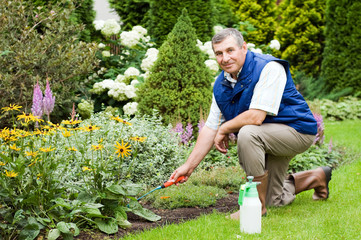 Man raking garden