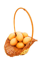 Basket full of eggs isolated on white