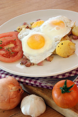 fried egg with organic potato and bacon