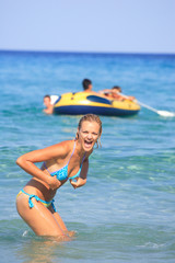 tanned woman in bikini in the sea