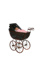 Fototapeta na wymiar antique baby carriage against high key background