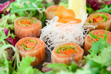 Sushi of daikon, carrot and salmon