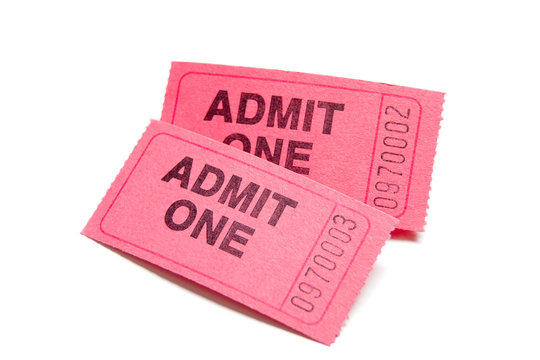 Two pink admission tickets on white