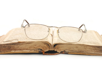 eyeglasses over open book