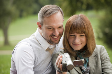 couple holding video camera