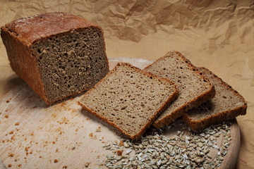 bread loaf and sliced bread on chopping board