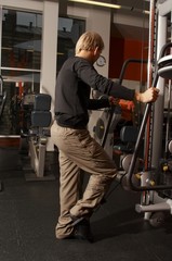 Fototapeta na wymiar a male bodybuilder working out in gym