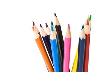 Assortment of coloured pencils with shadow on white background